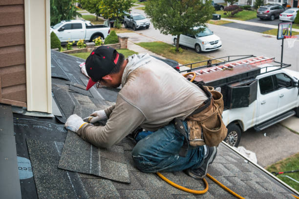 Professional Storm Damage Roof Repair technician working in Perry, OK
